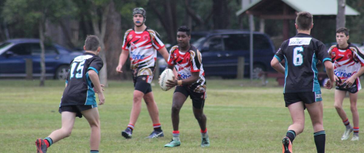 Jake Saunders from Red Rovers props as he confronts the Taree Panthers defence during the under 15 clash at Taree. Panthers won a tight game.