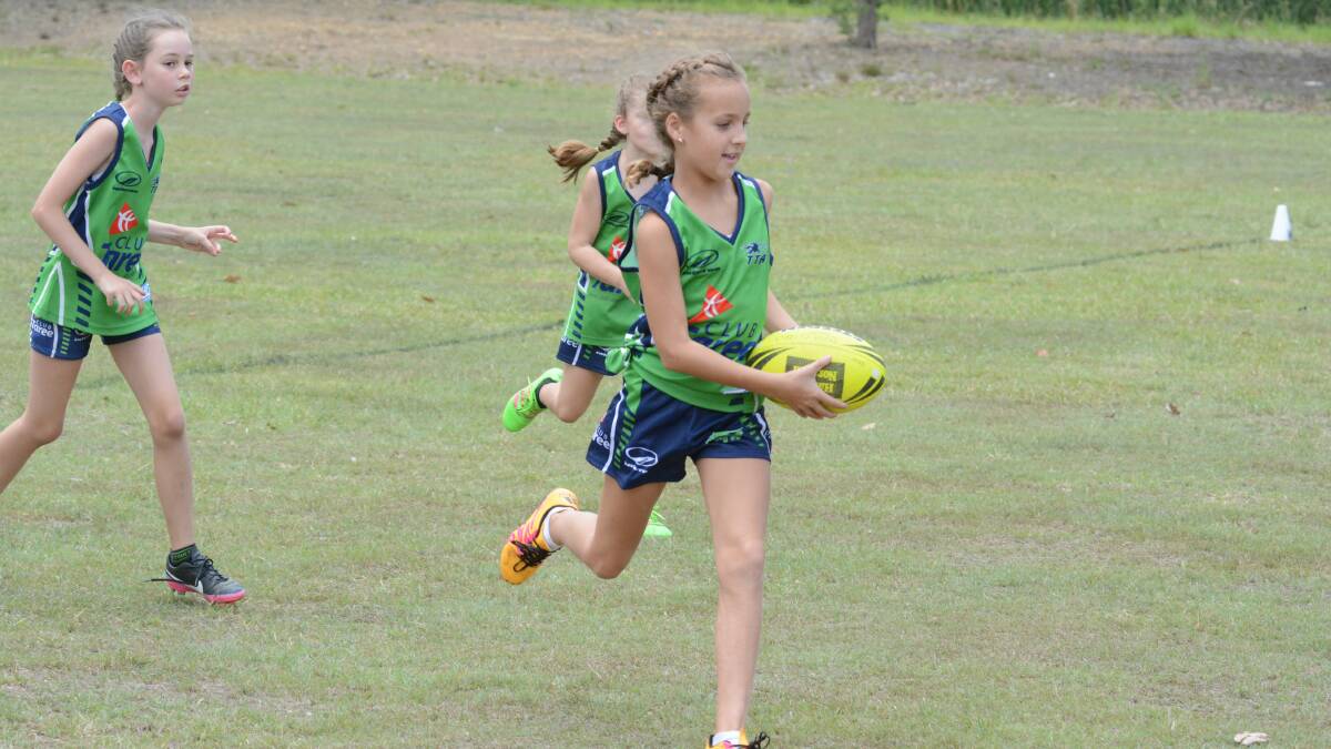 Mia Wall makes a dash for Taree under 10s during the recent gala day held at Taree Recreation Centre.