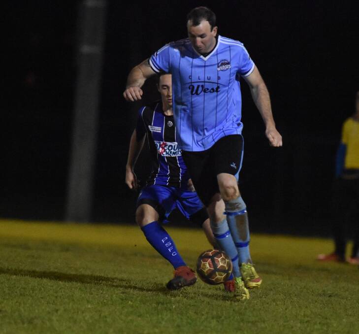 Taree's Ricky Campbell goes on the attack against Port Saints in the midweek clash at Port Macquarie. Campbell was a goal scorer in Taree's 5-1 win. Photo Port News.