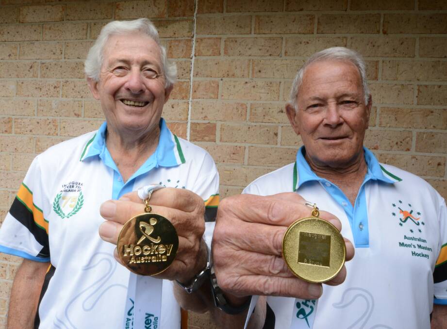 Gold strike: Peter Cubbin and Bob Bruce with their gold medals won at the Australian over 75 hockey championships.
