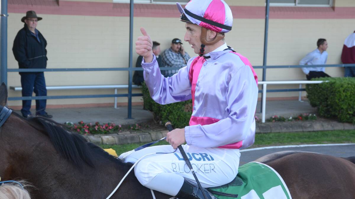 Jockey Ben Looker gives the thumbs up after his win on Mr McBat in the Wingham Cup earlier this month. He will ride the galloper in Sunday's Wauchope Cup at Port Macquarie.
