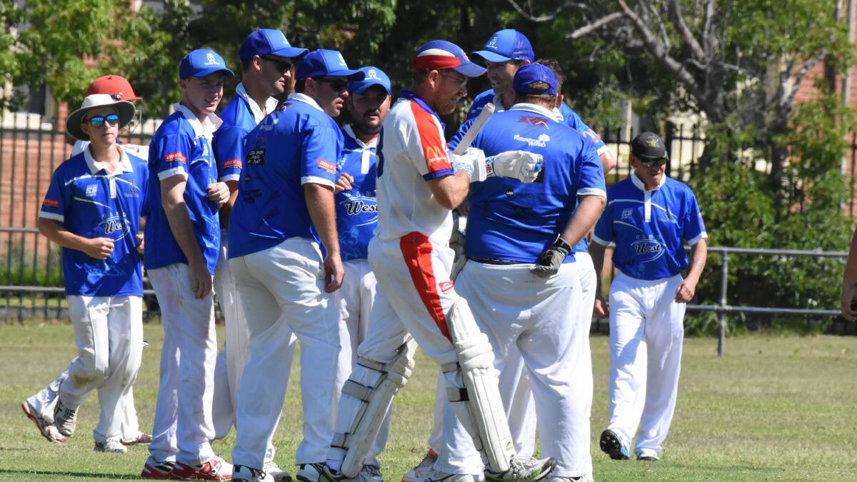 Taree West players celebrate after taking a wicket during the win over Wauchope RSL, the side's first of the season.