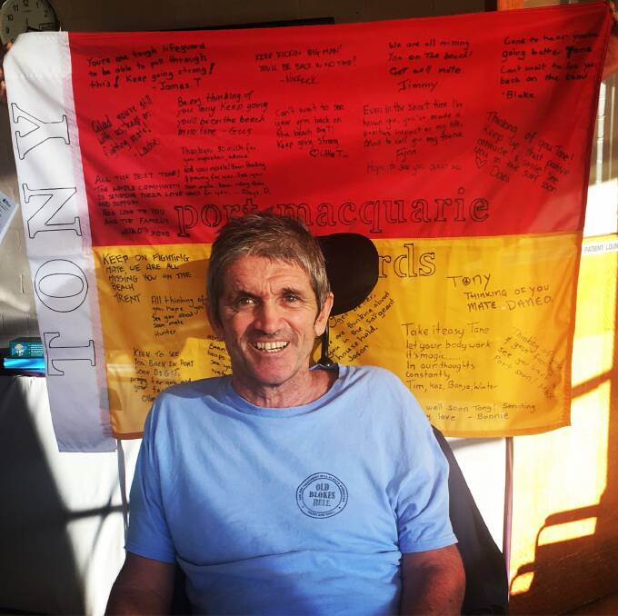 Community support: Australian Lifeguard Services members in Port Macquarie-Hastings signed a flag of support for Tony Wright. Pic: James Turnham