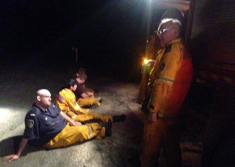 It's coffee time with a few scotch finger biscuits at 4am at the devastating Pappinbarra fires: Lansdowne crew members, Tim Buxton, John Hawkins and Robert Hawkins with two members from the Taree brigade Troy Wendell and Shane Johnson.