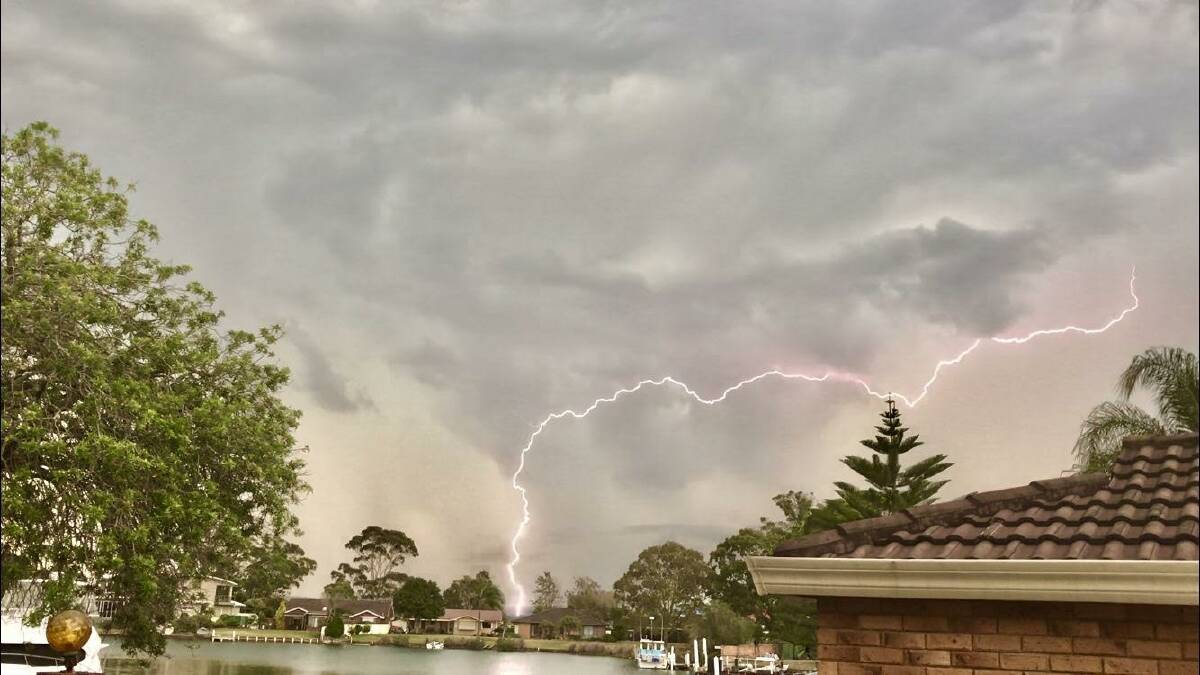 Christmas Eve storm: Brett Tappin took this photo on Christmas Eve of lightning hitting the ground behind Tuncurry canals.