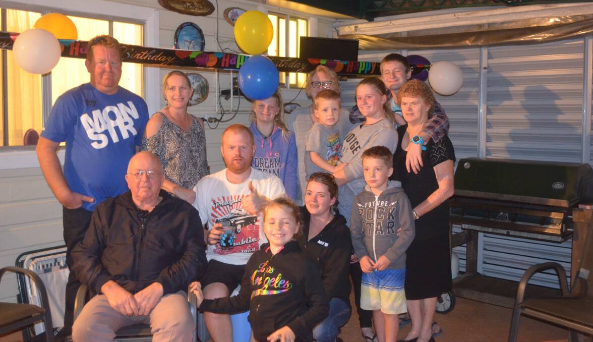 Celebrating with family and friends: Allan Sowter, seated left, on his 70th birthday party at his home.