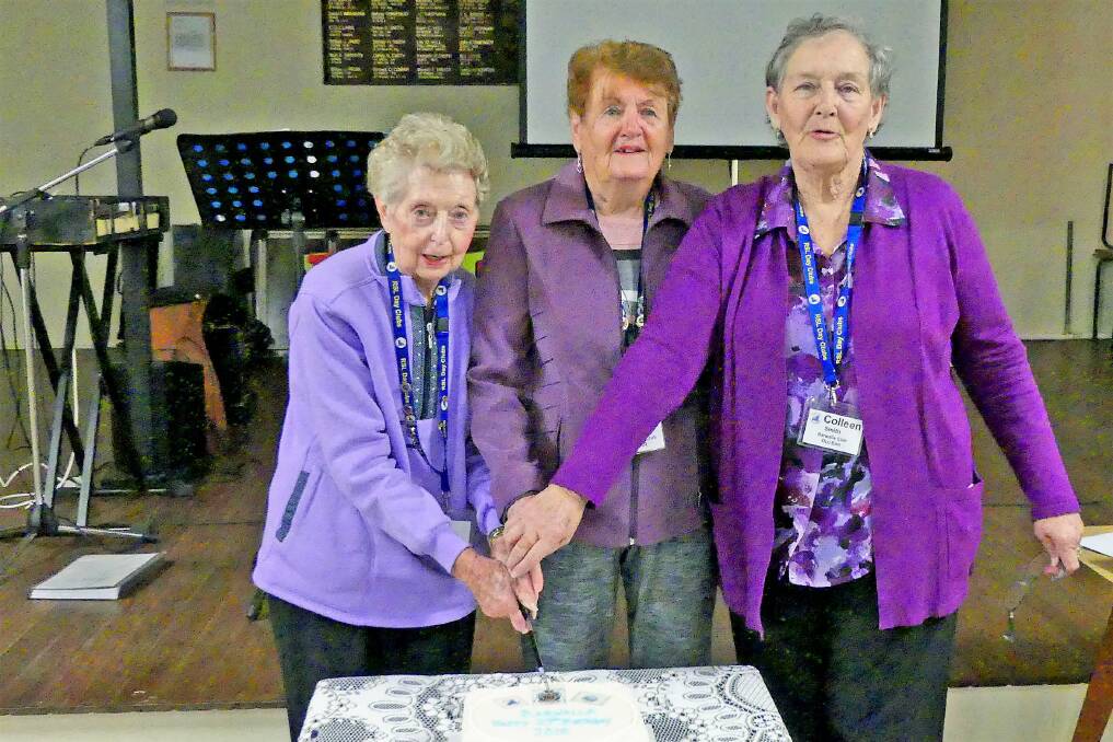 Barwalla celebrations: Dot Elliott, Liz Albaek and Colleen Smith cutting the birthday cake.