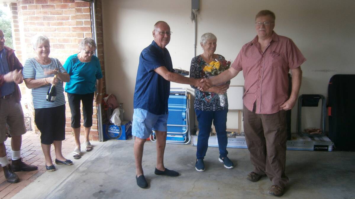 President of the Great Lakes Historic Automobile Club, Cliff Stockley presented bouquets to Dianne Tipping and Kevin Barnard in appreciation of them making their new home available to the club for their Mother's Day lunch.