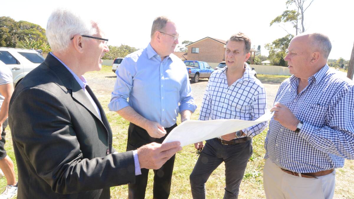 Cycleway plans: MidCoast Council general manager Glenn Handford, member for Myall Lakes Stephen Bromhead, transport minister Andrew Constance and council administrator John Turner inspecting the map of the proposed cycleway route.