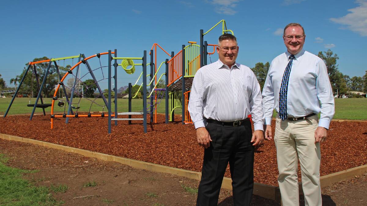 MidCoast Council's Paul de Szell and State member Stephen Bromhead at Ruprecht Park's new playground. The children told council they wanted things they could climb and things that would spin fast.