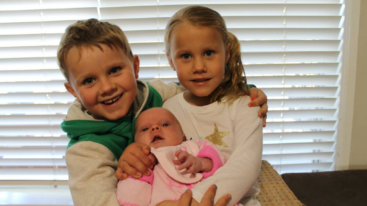 Proud siblings: Eli and Tessa with new baby sister Lara Lillian Saville.