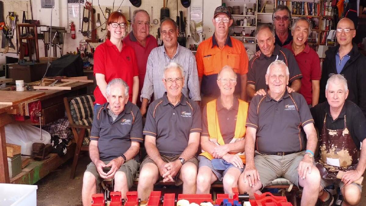 Arncliffe Men's Shed members proudly presenting the toys they made for children in local hospitals.