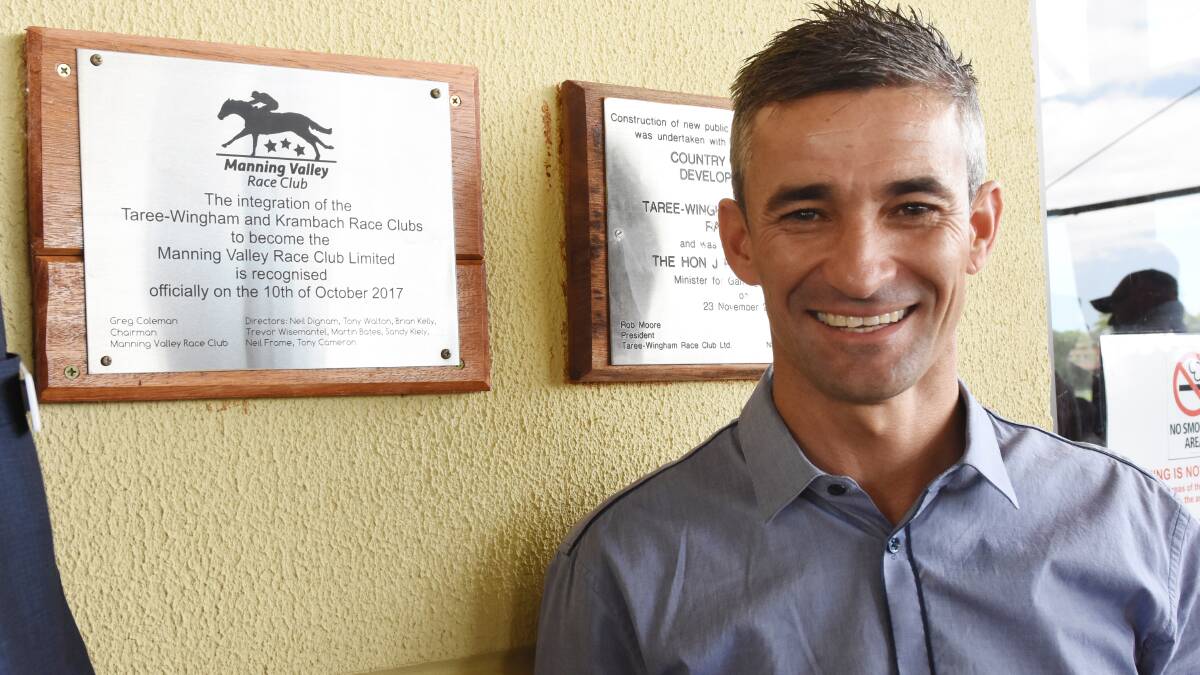 Champion jockey Corey Brown unveils the plaque to officially launch the Manning Valley Race Club yesterday at the Bushland Drive Racetrack. Photo Scott Calvin.