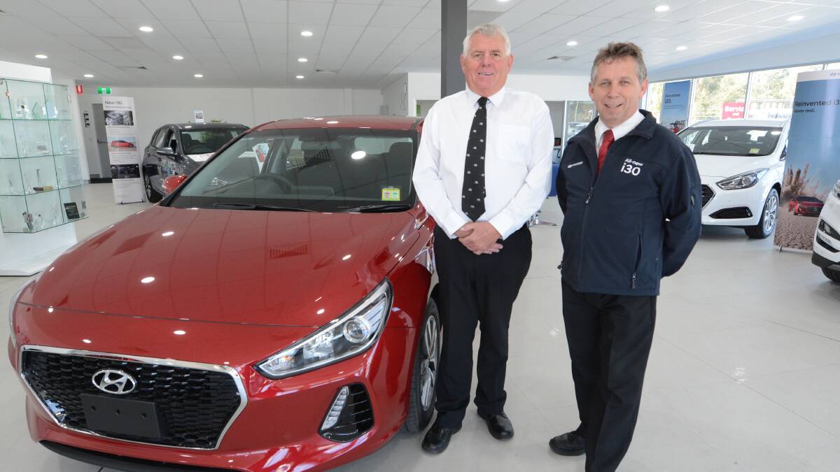 Hyundai dealership: Senior salesman Shane Callow and general manager Tony Cowan of Taree Auto Group. The dealership takes part in the Help for Kids project. 