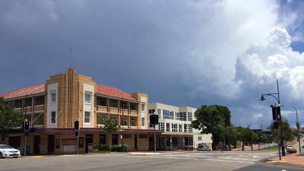A storm builds behind Taree's art deco hotel.