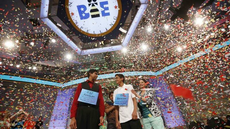 Sriram Hathwar of Painted Post, New York, stands next to his mother Roopa (R) as he and Ansun Sujoe (L) of Fort Worth, Texas are joint winners of the 87th annual Scripps National Spelling Bee 