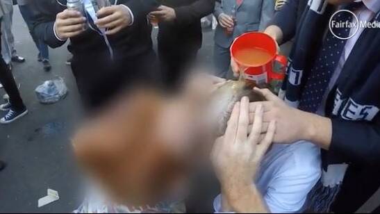 Graphic video shows University of Newcastle students drinking alcohol of genitals, participating in hazings of new college residents.