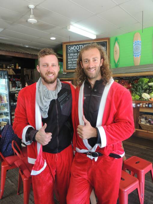 MOTORCYLCING SANTAS: Ryan Condon and Karim Kaufman from Byron Bay drop in to the Green Room cafe in Crescent Head. 