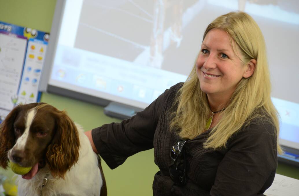 Narelle Campbell with her dog Gus during a chat at Coopernook School in 2013. 