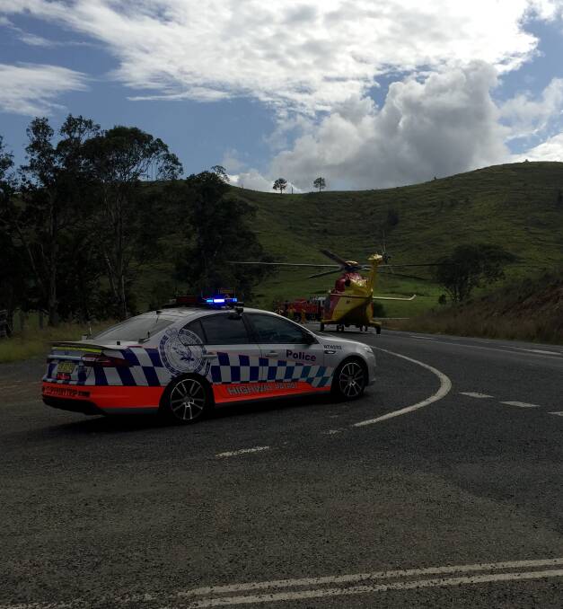 Westpac Rescue Helicopter getting ready to airlift injured person from car accident on the Bucketts Way. Photo: Anne Keen