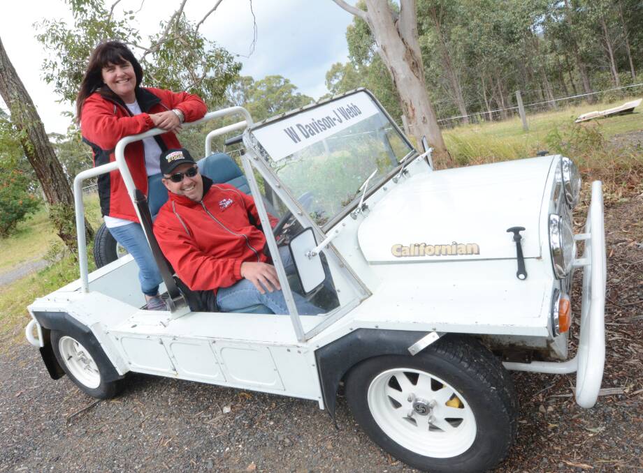 Driven by fate: Meaghan and James Lucas of Old Bar are the owners of the Californian Moke which drove winners of the Bathurst 1000 in the Drivers Parade at Mount Panorama Circuit. The car was owned by Meaghan's late father. 