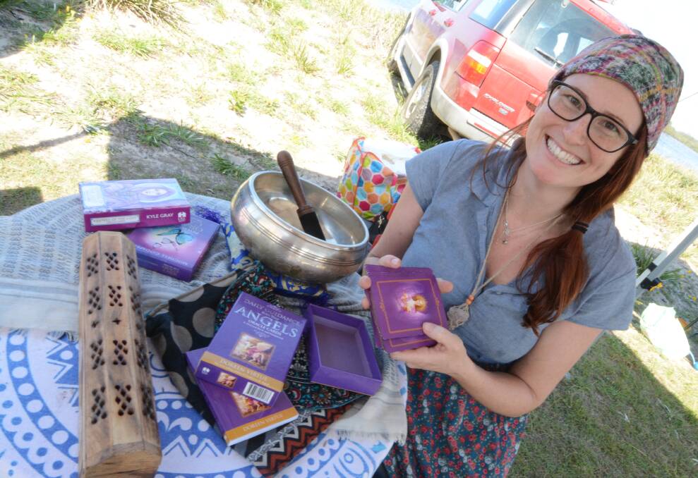 Empowering others: Kate Darnell of Gumboots by the Sea at the Crowdy Harrington Marine Rescue Markets on Easter Monday. Kate uses cards, oils and meditation to help others. Photo: Scott Calvin. 