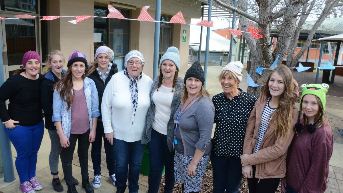 Ashley Doorey (centre) with supporters of the Beanies for Brain Cancer fundraiser at Taree TAFE. 