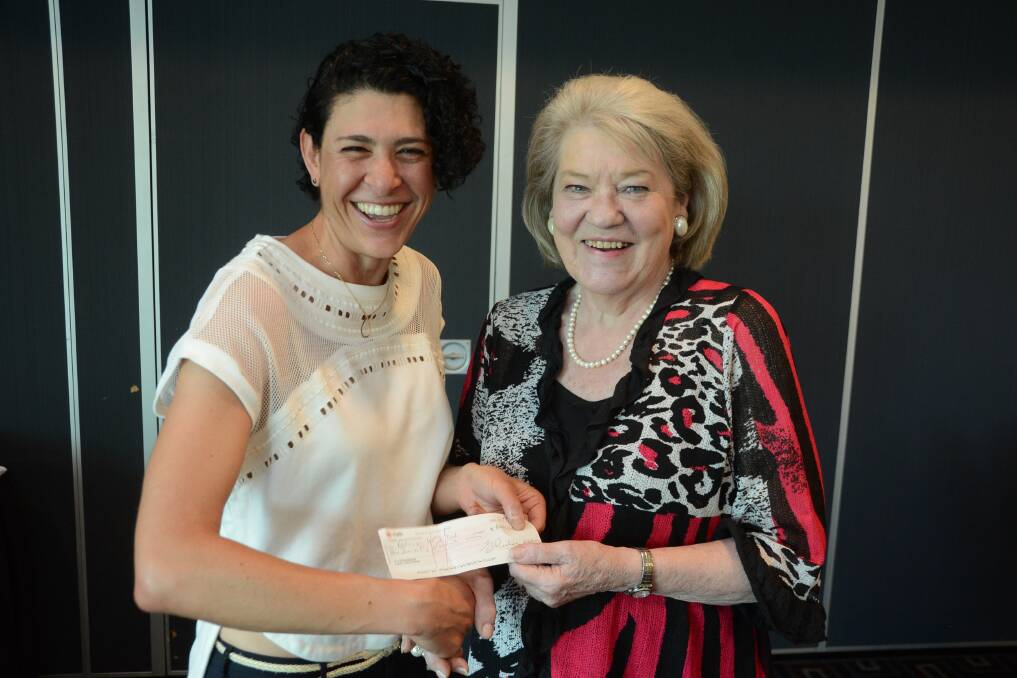 Author and cancer research advocate Tanya Saad receives a cheque of $2000 from Manning Winter Festival committee president Mave Richardson. The funds will go towards Ovarian Cancer Research. 