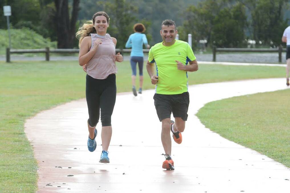 Running for a cause: Joanna and Garry Woolnough train together for a marathon rain or shine. Photo: Scott Calvin.