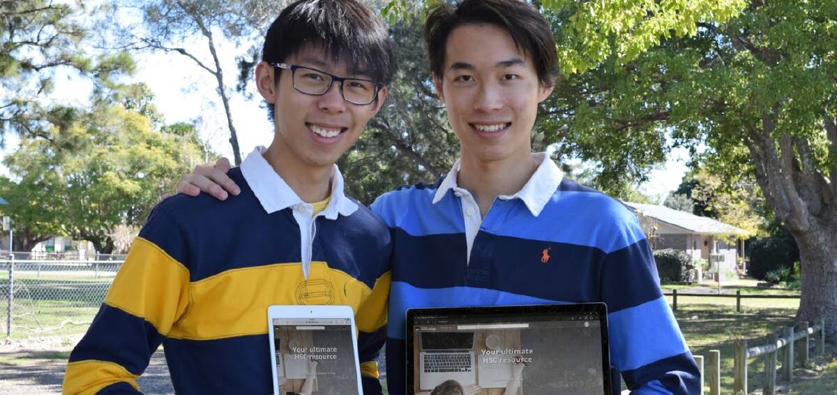 Problem solvers: Taree's Kenneth and Thomas Tsang hold the iPad and laptop version of their website HSCninja. The pair designed the website as being ‘syllabus-first’. 