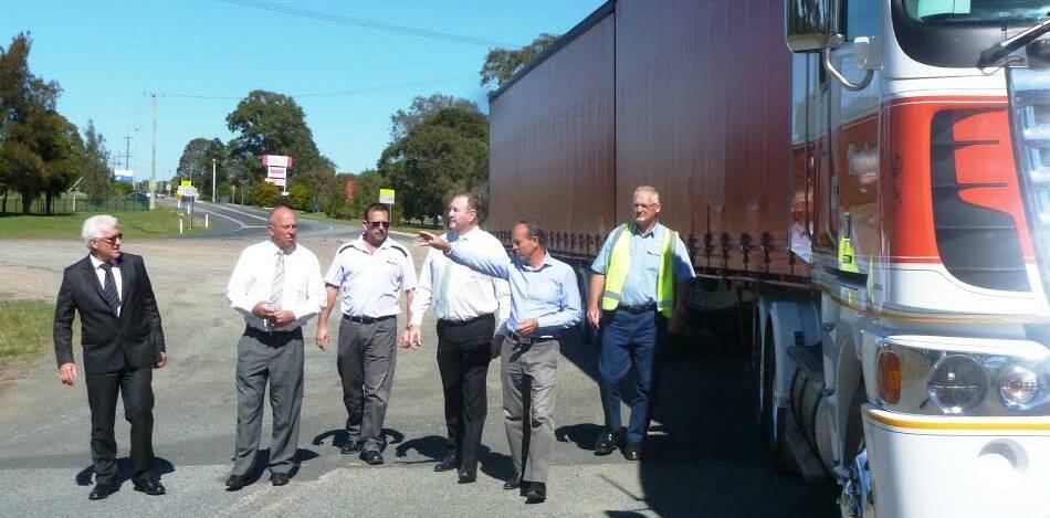 MidCoast Council representatives Glenn Handford and John Turner, MP Stephen Bromhead with Jim Pearson and Pearson Transport employees.