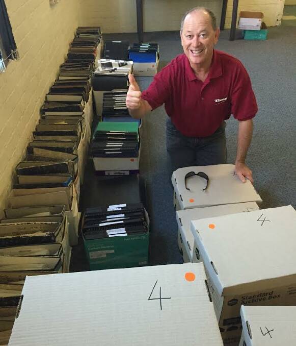 Let's do this: Times photographer Scott Calvin with rows and rows of boxes containing proof sheets on photo negatives right back until 1970. The negatives will be stored at the Victoria Street office. 