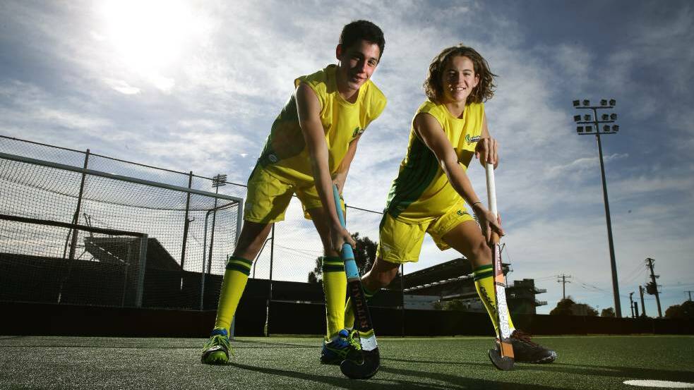 GREEN AND GOLD: Rory Walker and Sam Mudford try on their Australian under-16 All Schools uniform at Newcastle International Hockey Centre, Broadmeadow, on Sunday. Picture: Marina Neil 