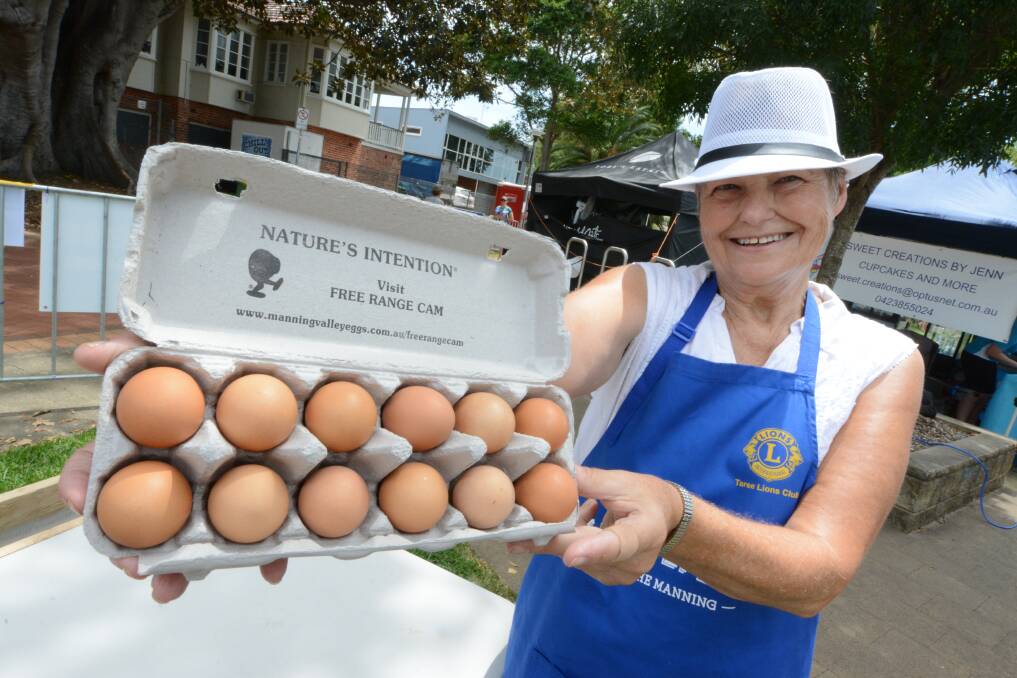 Taree Lions Club volunteer Trish Congreve holds a pack of Manning Valley Free Range Eggs - one of the many local producers featured at TasteFest on the Manning. 