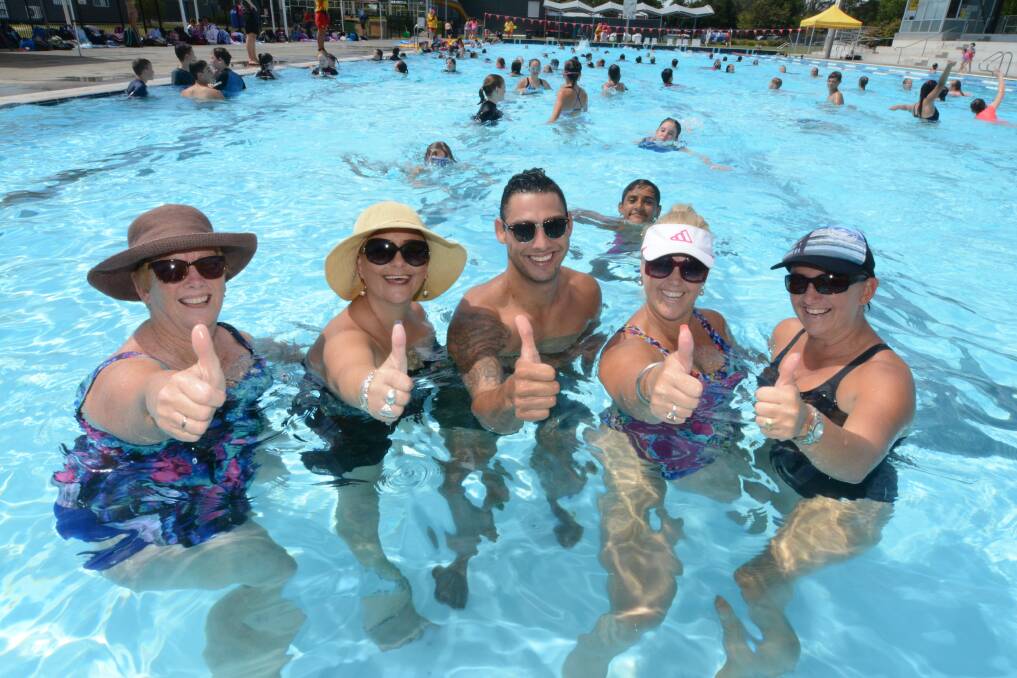 Teacher's Aides at Taree High School Janelle Muldoon, Toni Hardes, Josh Wood, Justine Bridges-Rodgers and Cathy Van Kampen cool down in the pool. 