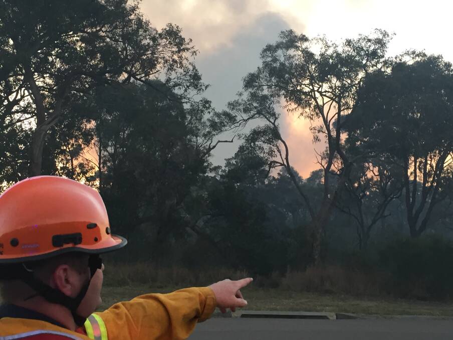 Lower Hunter RFS incident controller John Russell in Young St, Heddon Greta on Saturday night. Picture: Chad Watson
