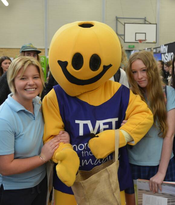 Super opportunity: TVET Man was full of future career and study advice for Great Lakes College students Lyndsay Hoare and Jodie Philbrook at the 2016 Taree District Careers Expo on Friday. Photo: Lachlan Leeming