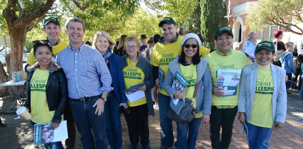 At Taree High: Dr David Gillespie (third from left) with supporters on election day at Taree High, where he cast his vote.
