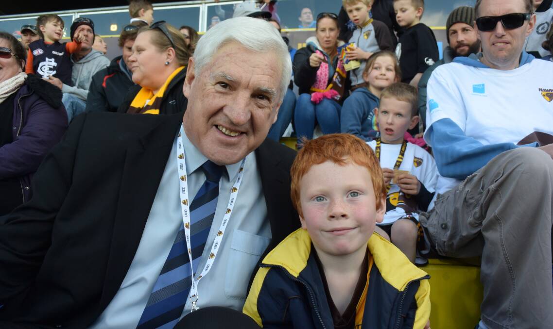 Hawks Club legend Peter Hudson and Isaac Allan, 6, of Launceston, sit in the new Huddo Family Zone. Picture: Tess Brunton