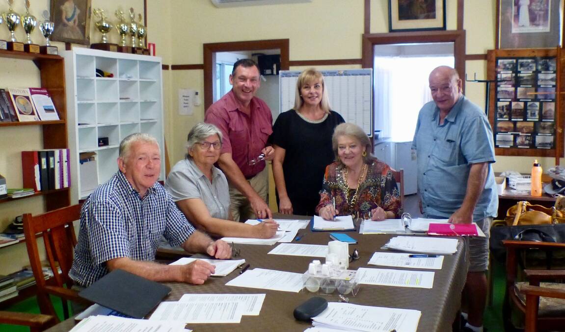 The 2018 Diggers Ball committee meeting at the Wingham Museum. From left Terry Gould, Kathie Bell (Secretary), George Hoad, Bronwen Gault (Treasurer), Mave Richardson (Chair), Terry Tournoff. 