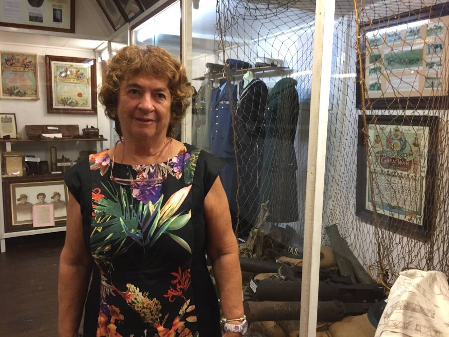 Manning Valley Historical Society researcher Margaret Clark stands beside the Wingham Museum war display being updated in time for Armistice Day in November.