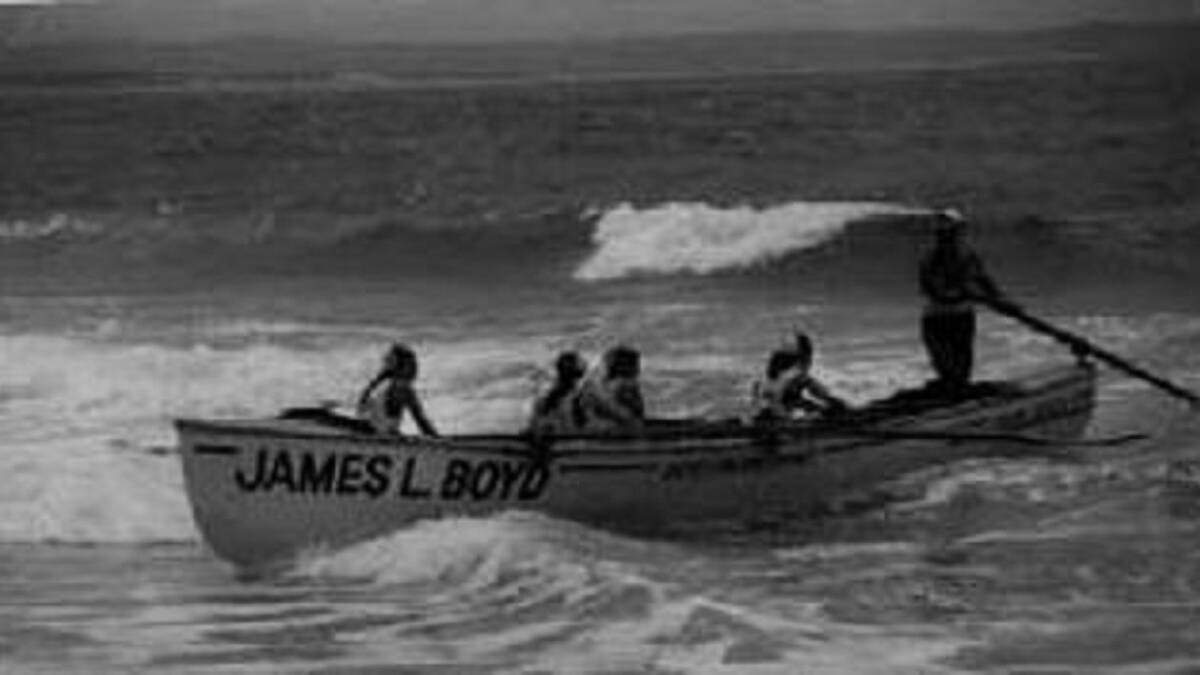 IN THE SURF: The Caves Beach Surf Life Saving Club's female surf boat team take to the water. They lobbied for a female event after being told they could not compete.