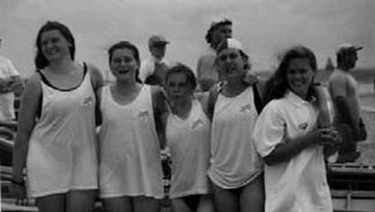 TRAILBLAZERS: A teenage Sheena, second from left, with fellow members of Caves Beach Surf Life Saving Club's first female surf boat race team in 1995.
