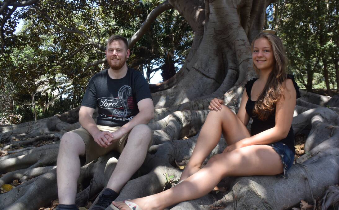 LOVING NEWCASTLE: Backpackers Tom Conway, of Ireland, and Pia Moellendorf, of Germany, kicking back in Pacific Park on Thursday. Picture: Brodie Owen