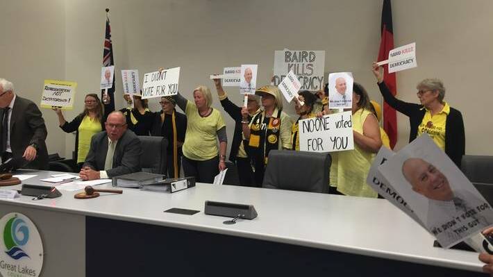 A vocal and colourful group of women chanting and brandishing placards forced the first ordinary meeting of the newly formed MidCoast Council to be abruptly abandoned