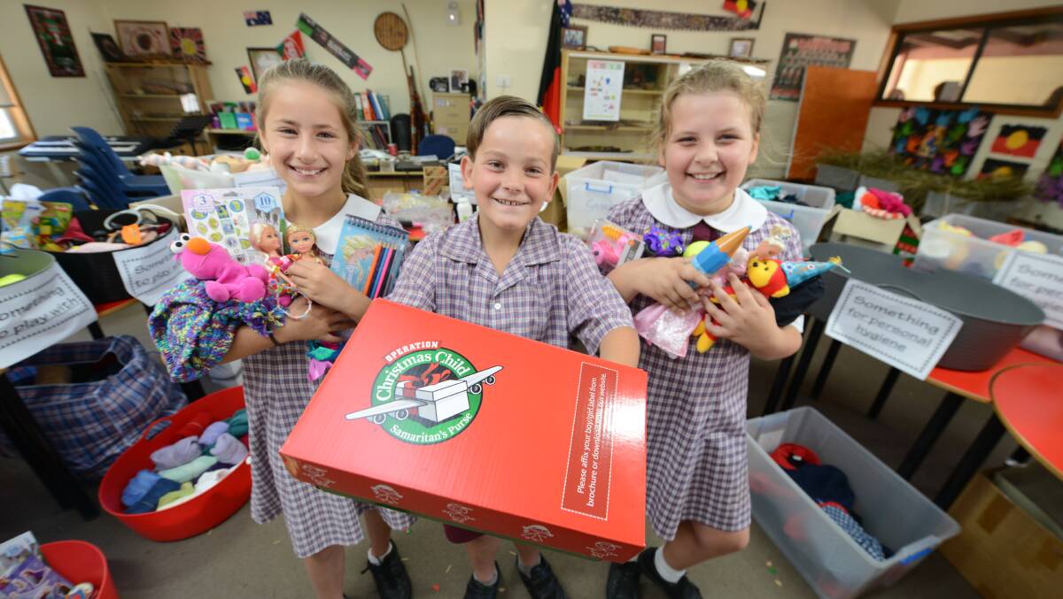Christian outreach: Julia Skender, Jack Wheatley and Alex McKinnon of Taree Christian College happily took part in the 2016 Operation Christmas Child campaign.