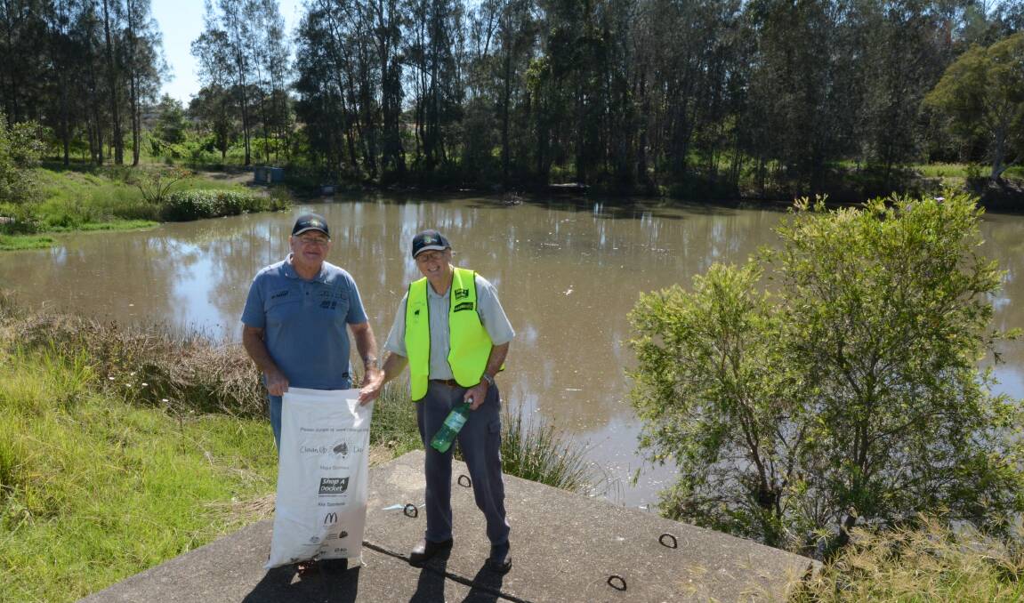 Dirty dam: Friends of Browns Creek volunteers John Elcoate and Bill Dennis will launch a boat to try to access "filth and rubbish" that is in a dam hidden in the heart of Taree. 