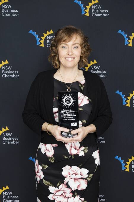 Monique Cahill proudly holds the Valley Cafe Excellence in Social Enterprise Award at the NSW Business Chamber Mid North Coast Regional Business Awards in Port Macquarie.