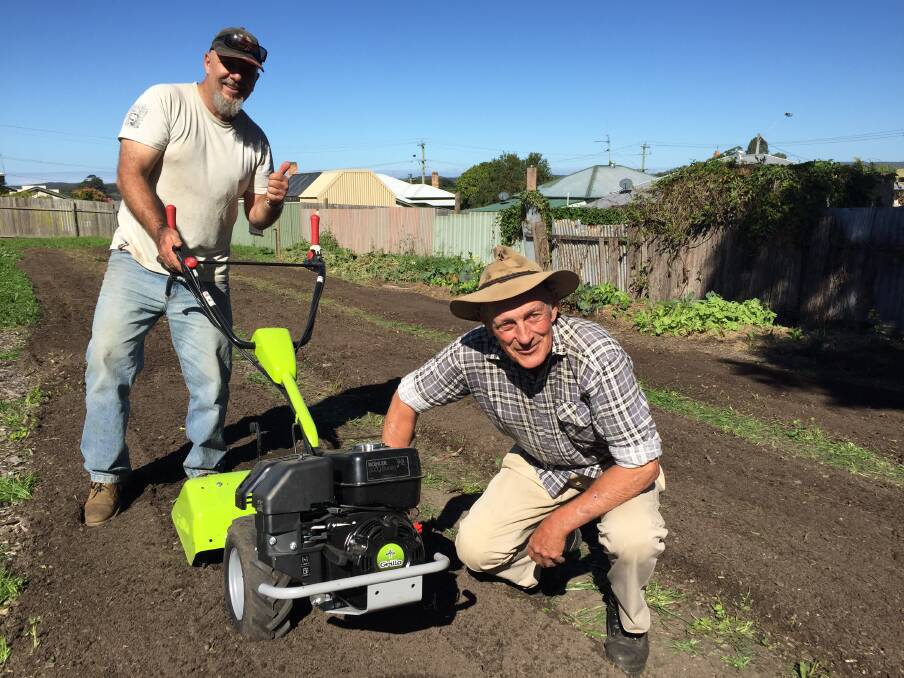 Graham Phillips (right) and Taree Community Garden horticulturalist, Darren Harrison today worked to prepare garden beds for the garlic planting working bee on Sunday. Photo: Ainslee Dennis