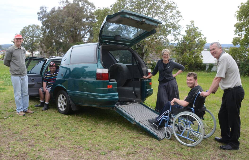 The gift of a wheelchair accessible car is cause for celebration according to About Inclusion staff and clients (from left) Dylan James, Isaac Carberry, general manager Donna Ballard, James Harding and support worker, Steve Wood. Photo: Ainslee Dennis.